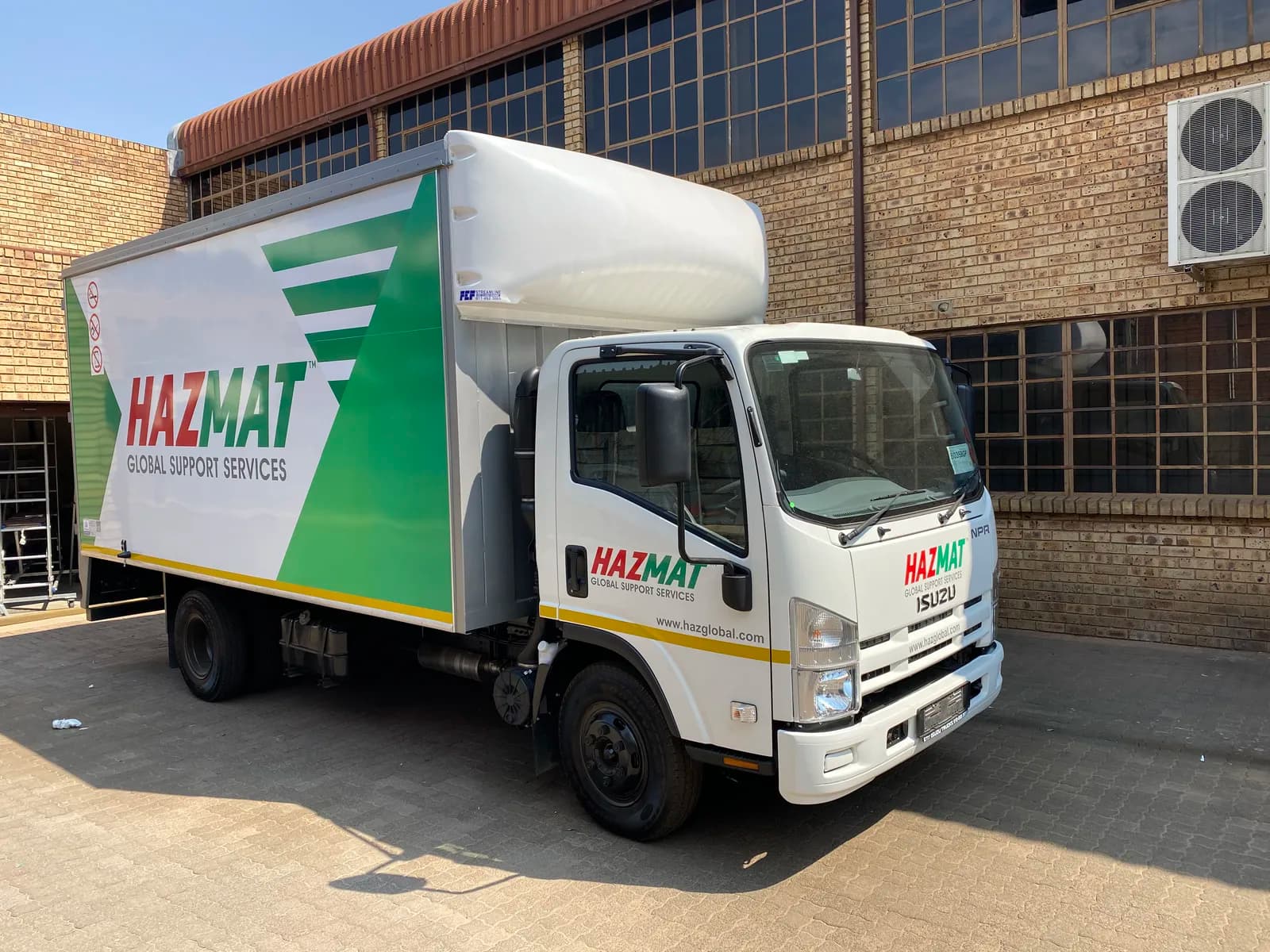 Hazmat branded Isuzu truck front view