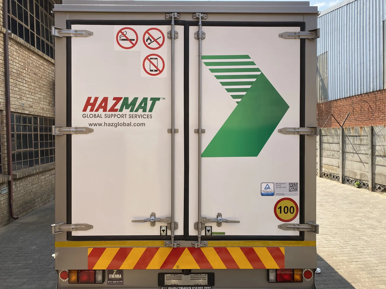 Hazmat branded Isuzu truck rear view